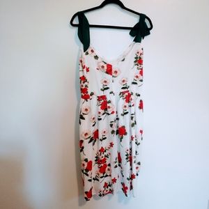 Floral dress with adjustable straps that can be tied to different lengths.  Size